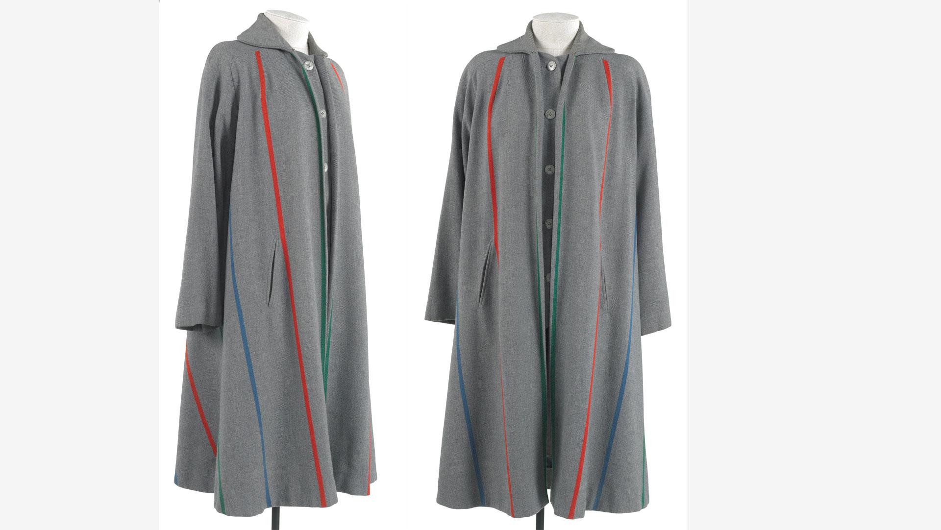 Designed and made by RIMA, an English ready-to-wear label, in 1947. The diagonal stripe of the coat is cleverly woven into the high-quality fabric, which despite appearances is not cut on the cross. The unusual inset panels at the front give the appearance of a matching waistcoat worn underneath. Collection of Te Papa