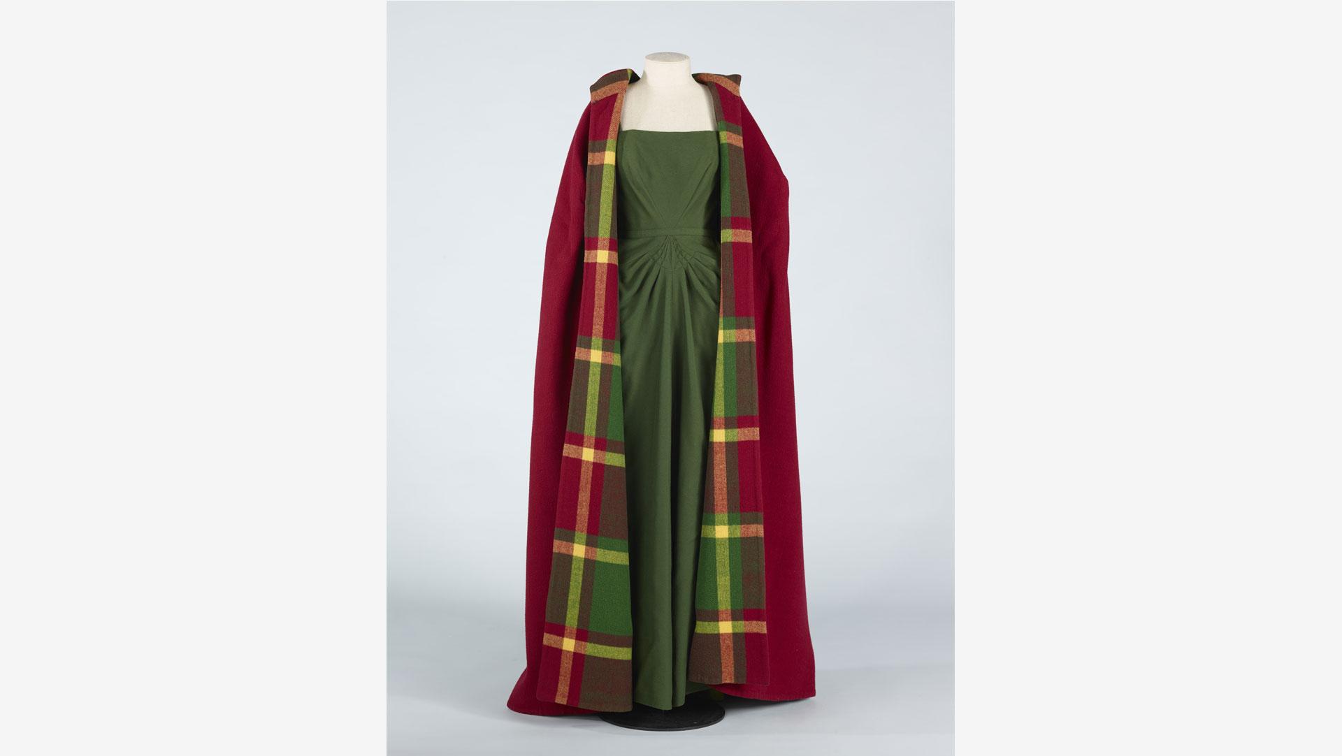 Madame Bruyere made the gown in wool to match the fine wool cloak. The ensemble featured in many of Mary Annette's wool productions as a perfect outfit for the opera. Collection of Te Papa.
