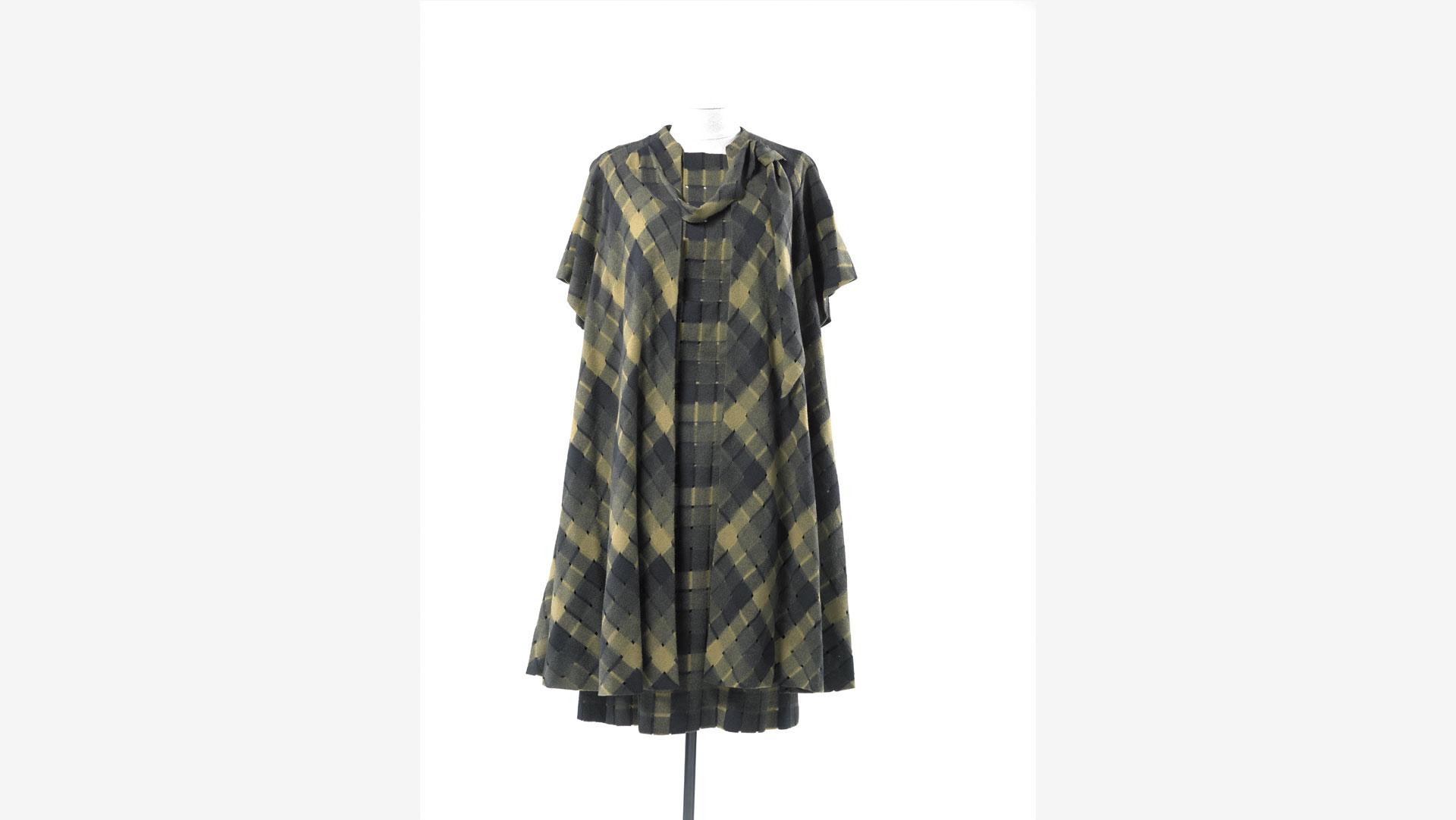 This ensemble by Norman Hartnell is made from a woollen fabric woven using a water soluble alginate fibre (derived from seaweed) which dissolved on washing to leave open areas. Mid-late 1950s. Collection of Te Papa.