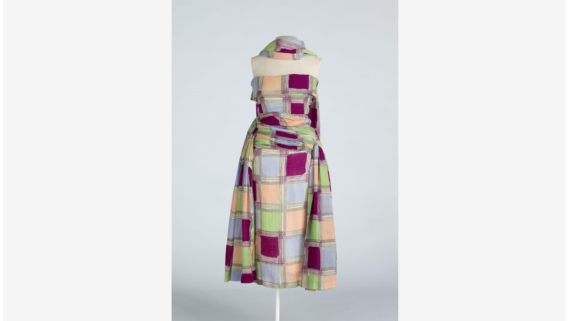 A strapless summer dress (1949) by English designer Elizabeth Henry. Made from an extremely lightweight and patterned wool it exemplifies Mary Anette's argument that wool was a fibre for all seasons, not just winter. The dress was originally mid-calf length and was later shortened. Collection of Te Papa.
